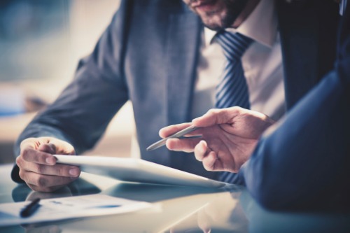 Investor reviewing rental property refinancing strategy