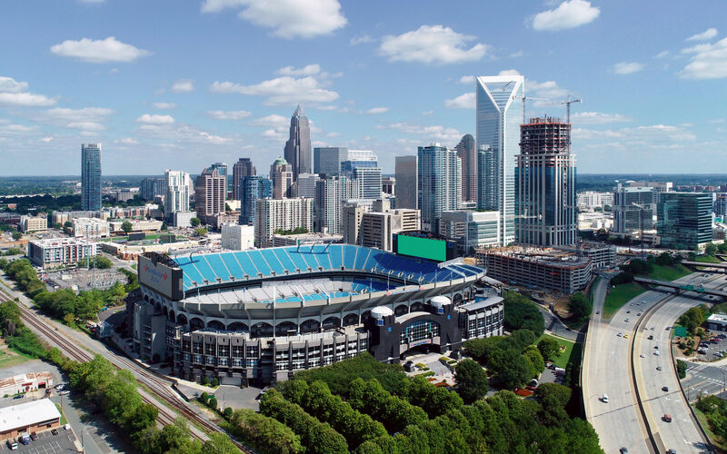 Charlotte skyline with modern bank towers rising above the tree-lined Uptown district