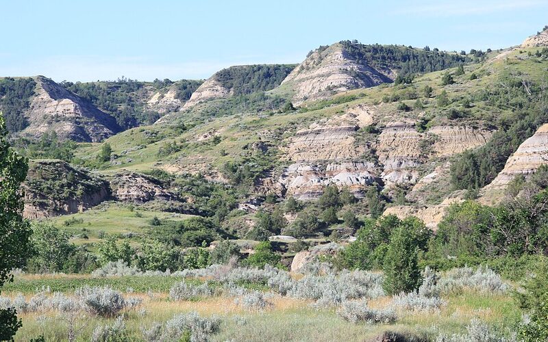 Colorful layered rock formations in the North Dakota Badlands at sunset