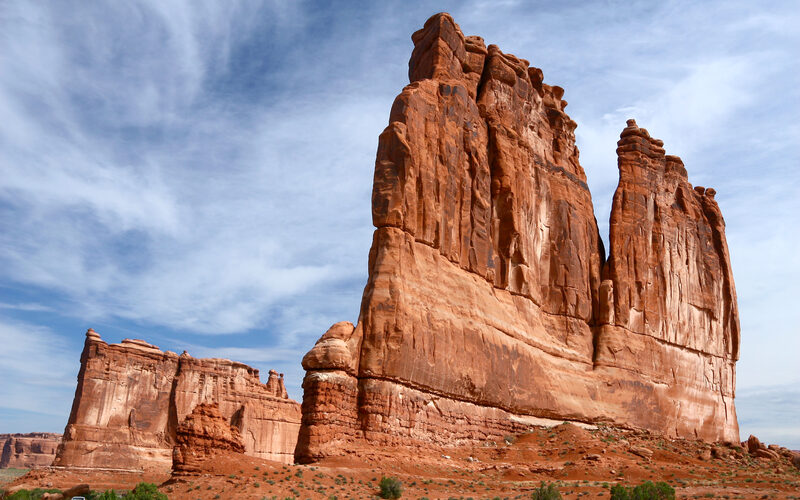 Dramatic red rock formations in Utah's canyon country against a blue sky