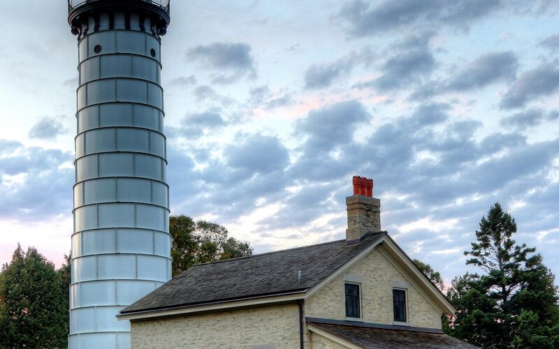 Door County lighthouse and keeper's cottage at twilight on the Wisconsin peninsula