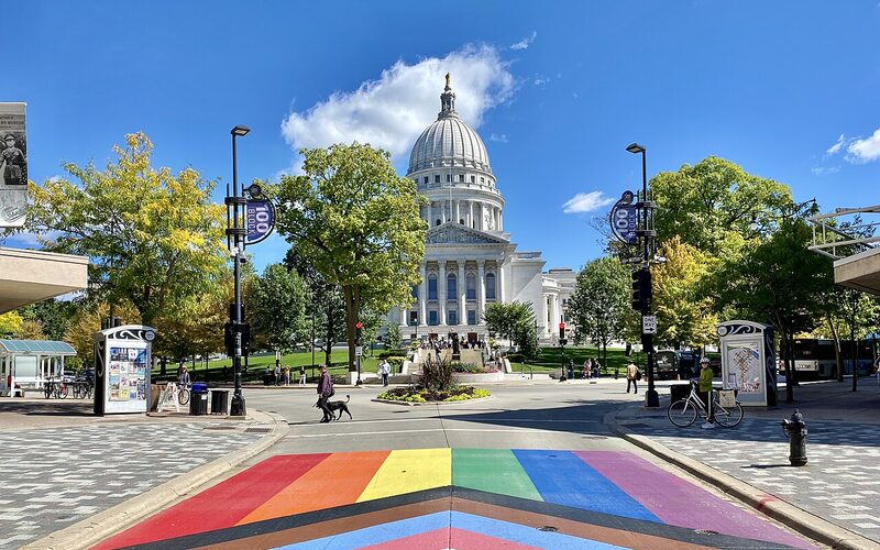 Wisconsin State Capitol building with rainbow crosswalk in Madison